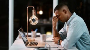 man looking frustrated at computer