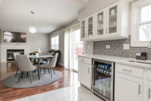 pristine modern white kitchen with glass cabinets