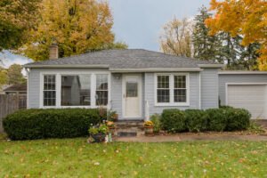 one story house with yard during the fall