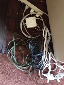 cluttered wires and powerstrips