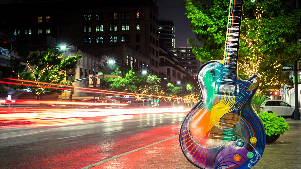decorative guitar on a busy Austin street