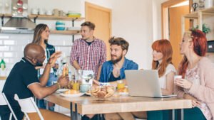 six people sitting together in dining room