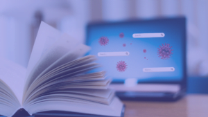 book in front of laptop with pictures of germ spores