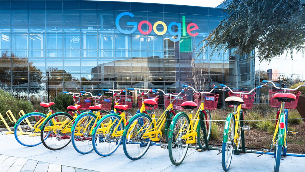 colorful bikes parked outside of Google workplace