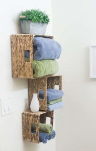 wall storage baskets holding towels