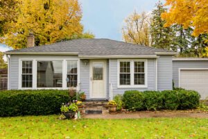 one story house with yard during the fall