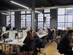 people editing photos in office