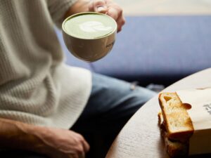 person holding matcha tea