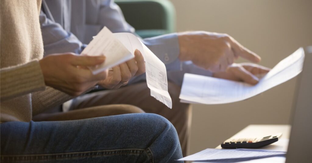 couple holding receipts