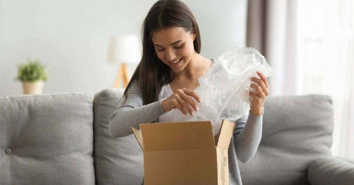 woman opening package