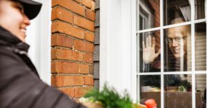 neighbor waving through window