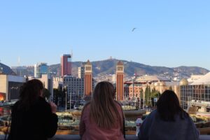 three women looking at town