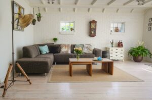 living room with grey couch and wooden table