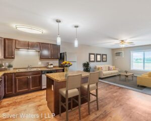 dining room with wooden floors and cabinets