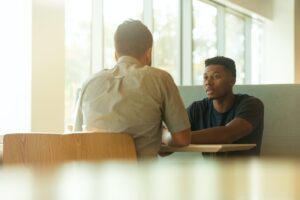 two people talking on table