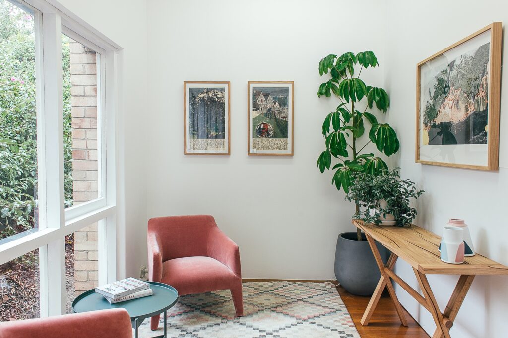reading room with plants and a chair