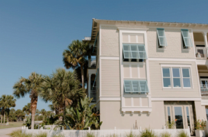 apartment complex with palms outside
