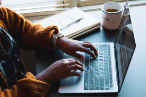 woman typing on laptop