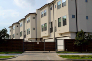 white townhouses in gated community