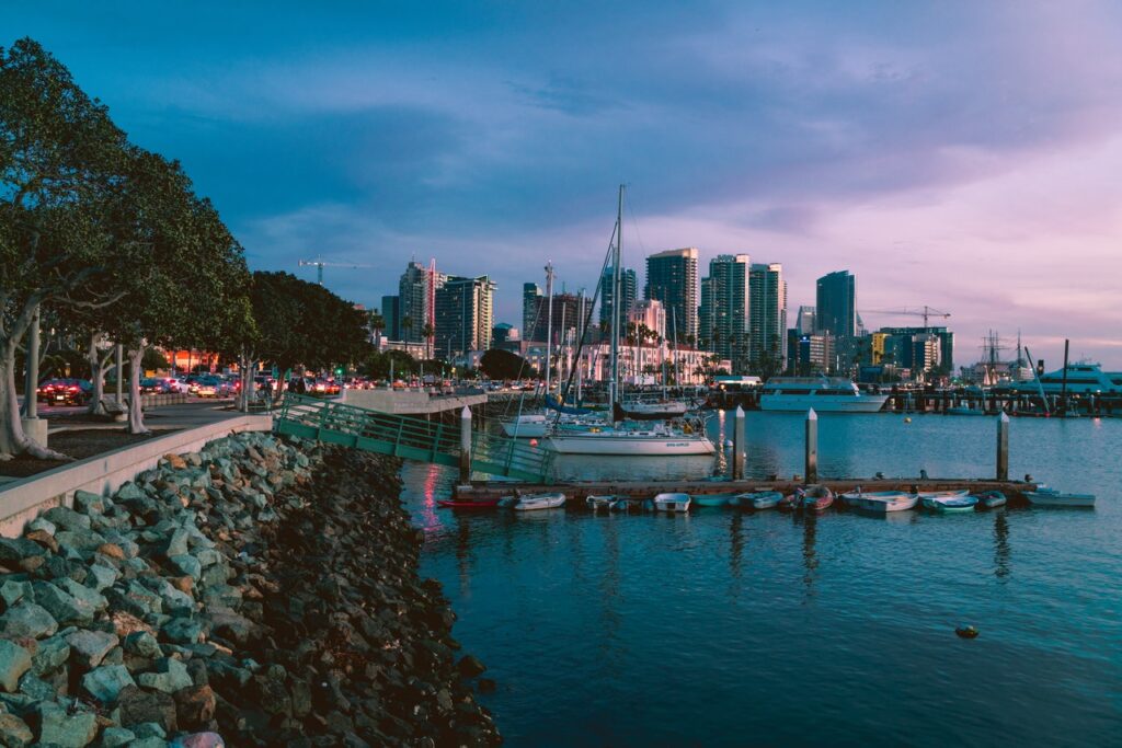 San Diego dock with ships and skyscrapers in the distance