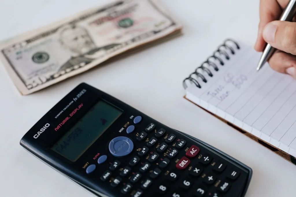 money and calculator on table