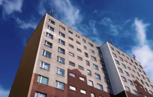 apartment building in front of blue sky