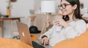 Renter using a laptop to explore rental listings with neighborhood insights